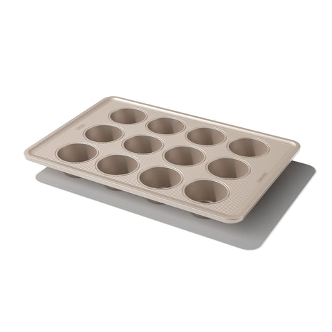 OXO Good Grips 12-cup muffin pan top view with easy-release non-stick coating.