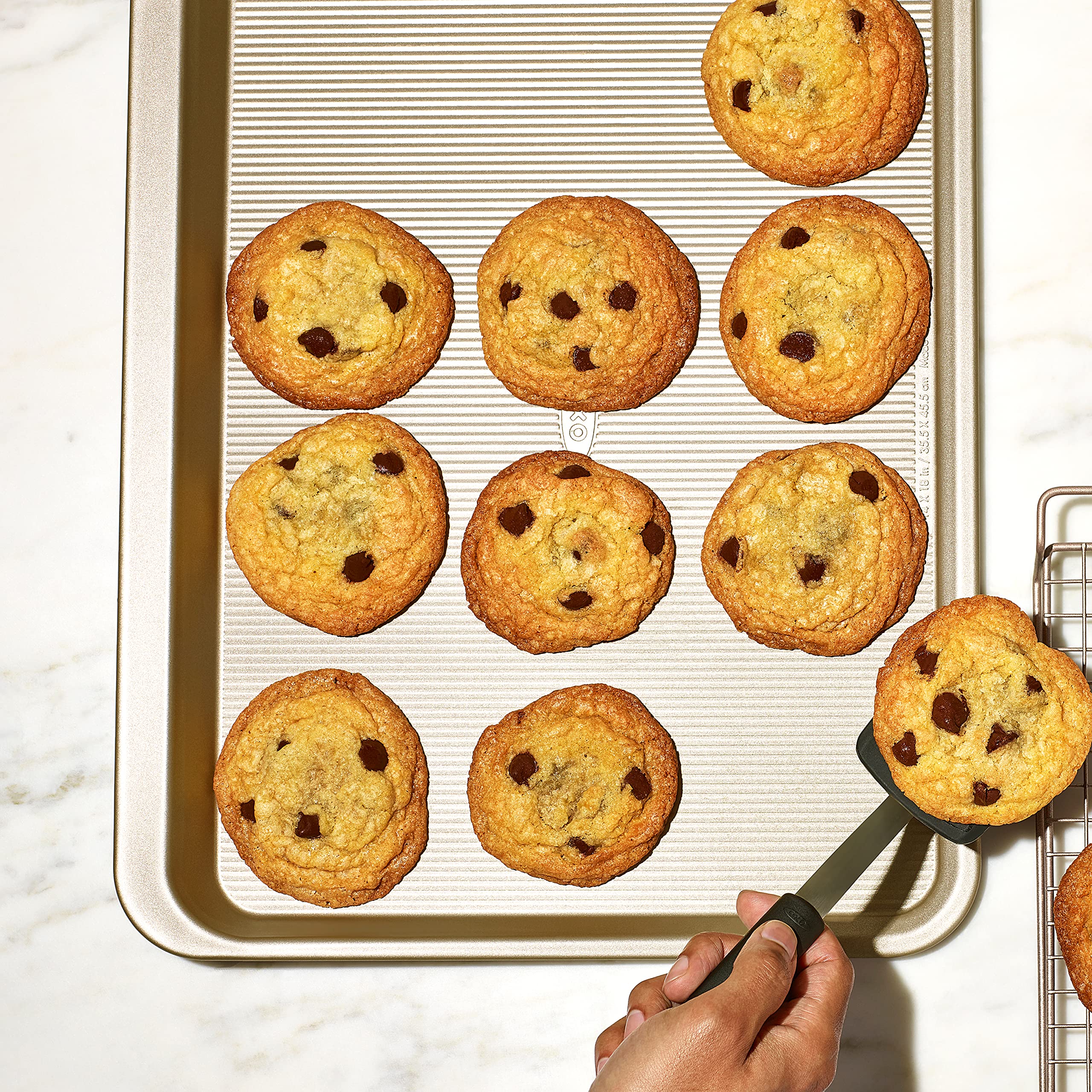 OXO Good Grips non-stick pro cookie sheet in use shows steady performance in heat.