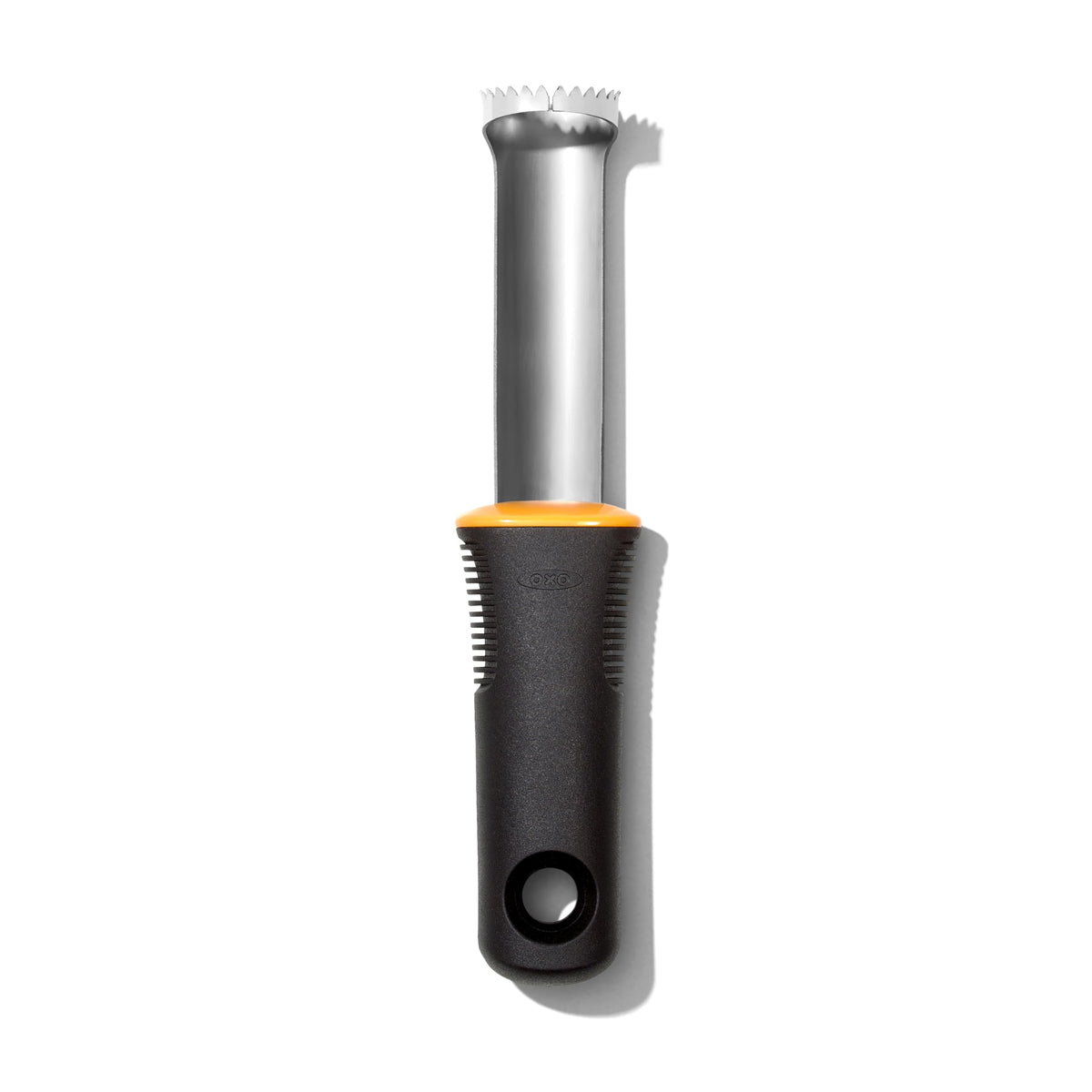 OXO Good Grips Peach Pitter in use to remove pits without bruising the fruit.