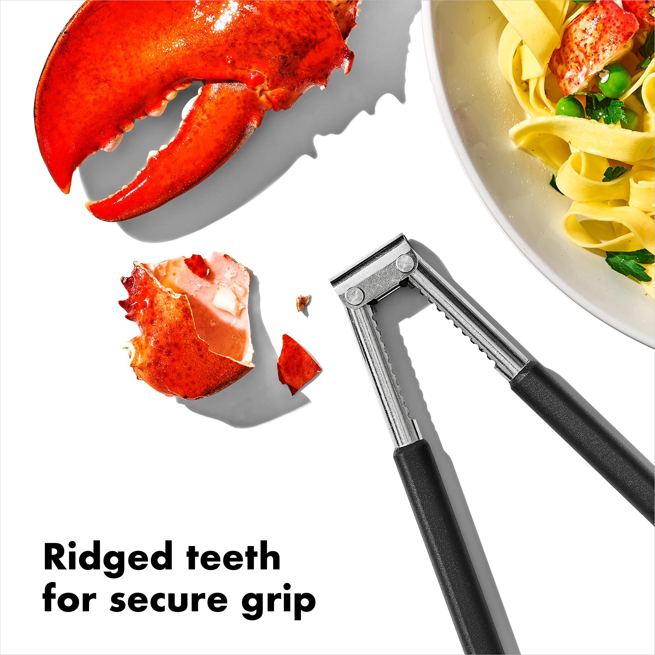 OXO Good Grips seafood & nut cracker in use cracking a crab leg.