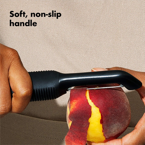 OXO Good Grips Serrated Peeler peeling peach skin without bruising