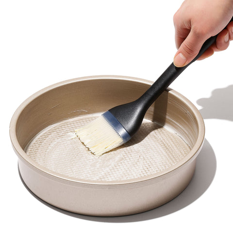 OXO Good Grips silicone basting brush used on roast