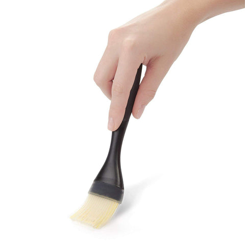OXO Good Grips silicone bristles channel liquid for steady transfer from bowl to food