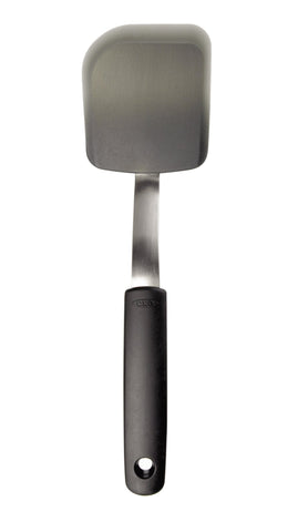 OXO Good Grips silicone cookie spatula on a cookie sheet for easy lifting