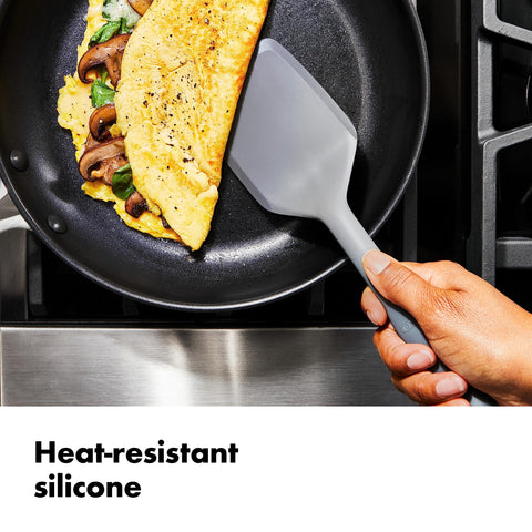 OXO Good Grips silicone ladle and spatula on nonstick surface.