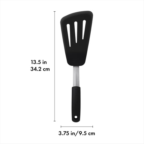 OXO Good Grips silicone omelet turner flips omelets with a flexible edge under food.