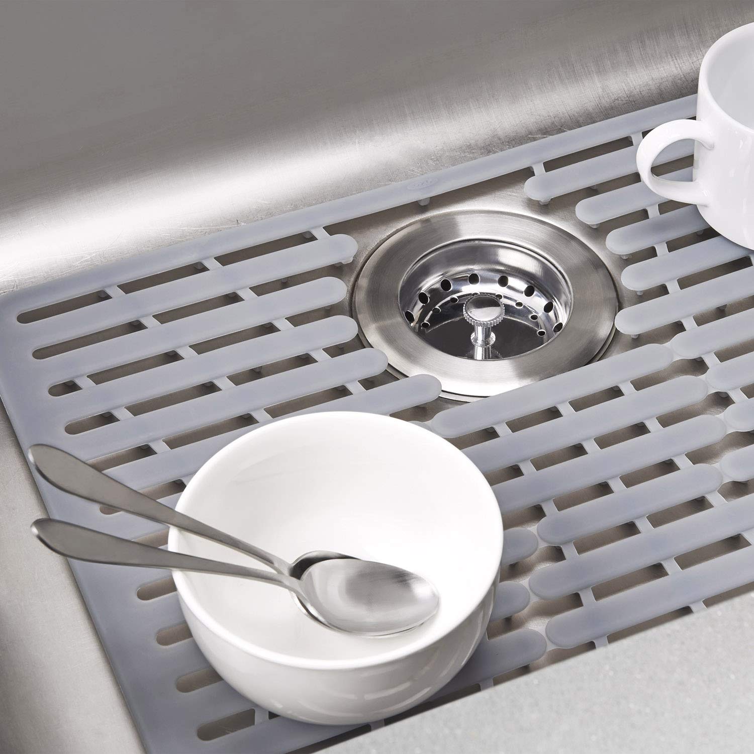 OXO Good Grips silicone sink mat small silver in use with dishes and hot pots