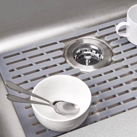 OXO Good Grips silicone sink mat small silver in use with dishes and hot pots