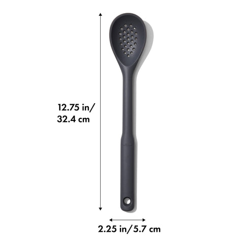 OXO Good Grips silicone slotted spoon Peppercorn in a pot draining vegetables.