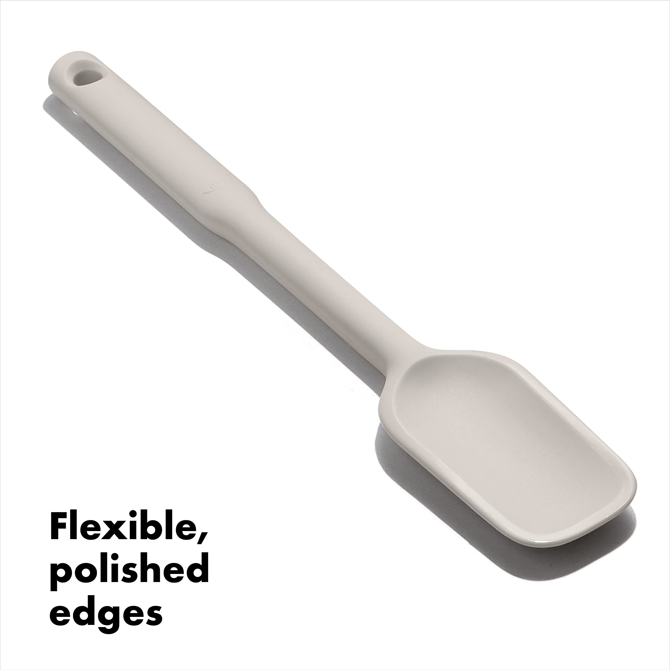 OXO Good Grips silicone spoon spatula's flexible edges reach bowl corners for thorough scraping.