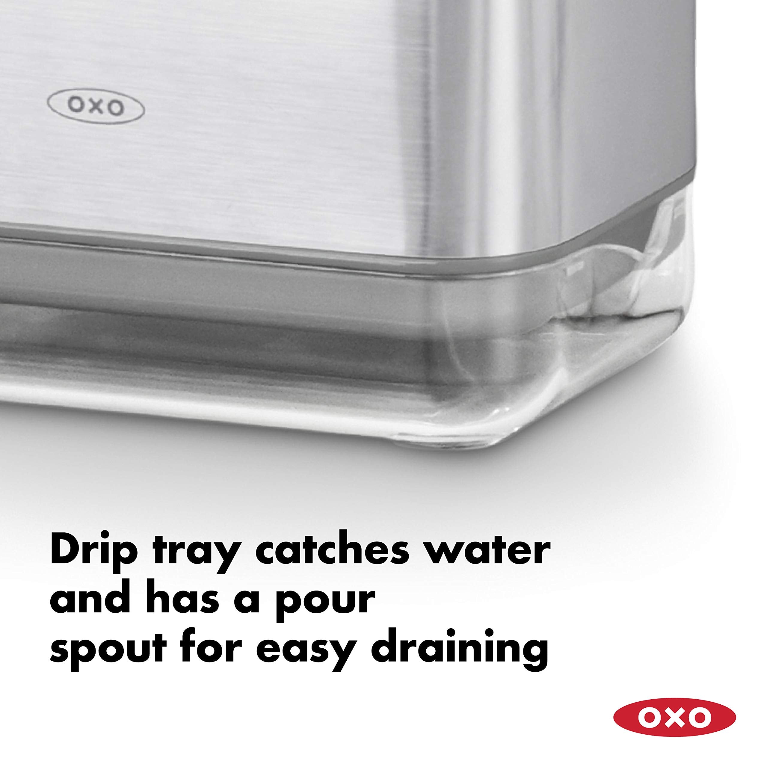 OXO Good Grips sinkware caddy holds two sponges and brushes using the divider