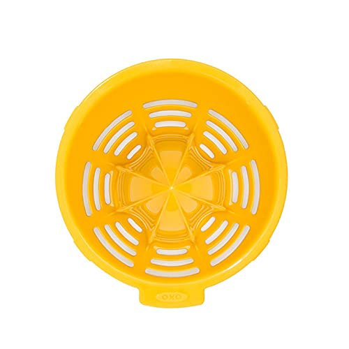 OXO Good Grips small citrus juicer cup shows clear 2.5 oz markings for precision.