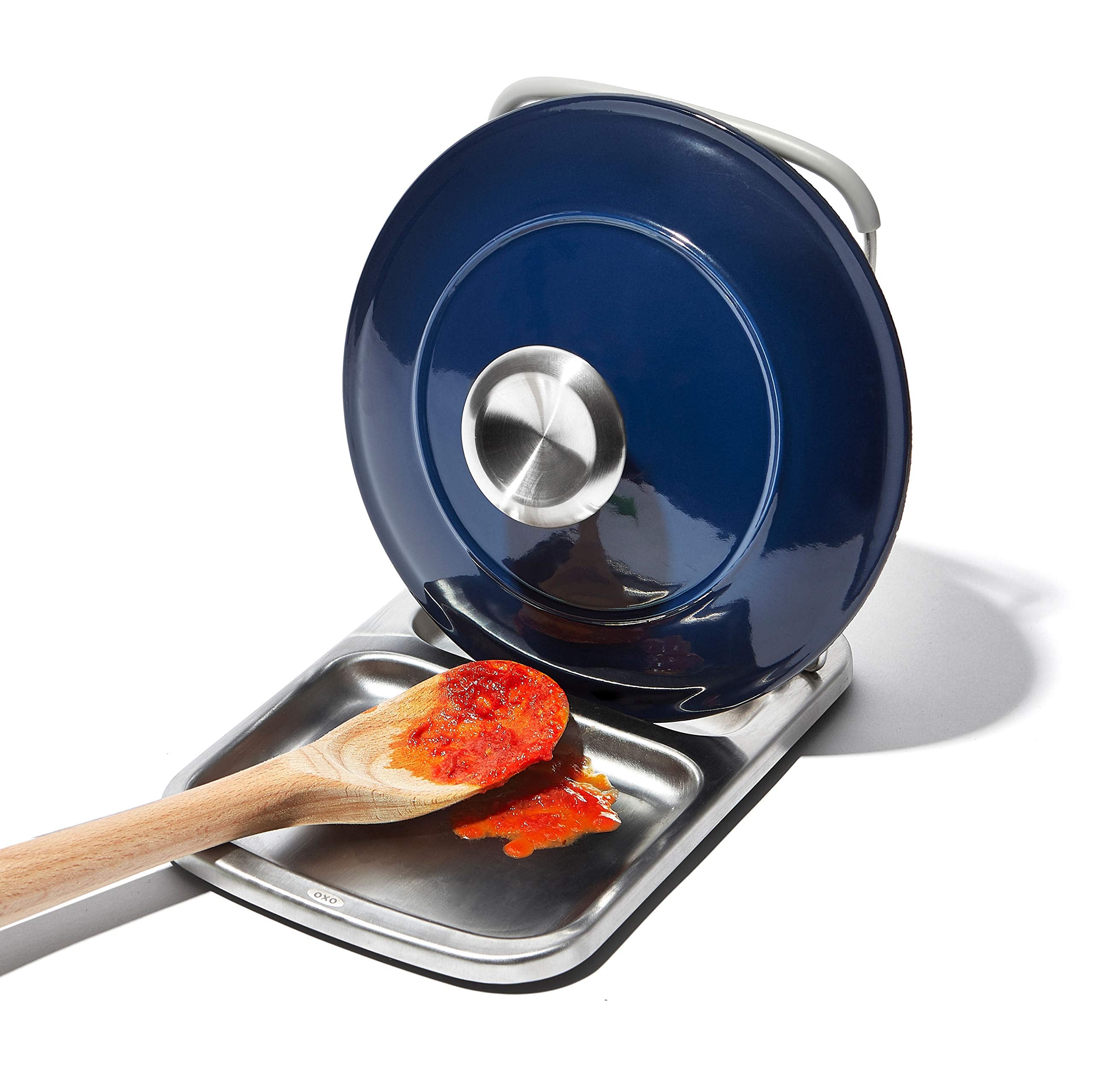 OXO Good Grips Lid Holder folded down for compact storage after cooking.