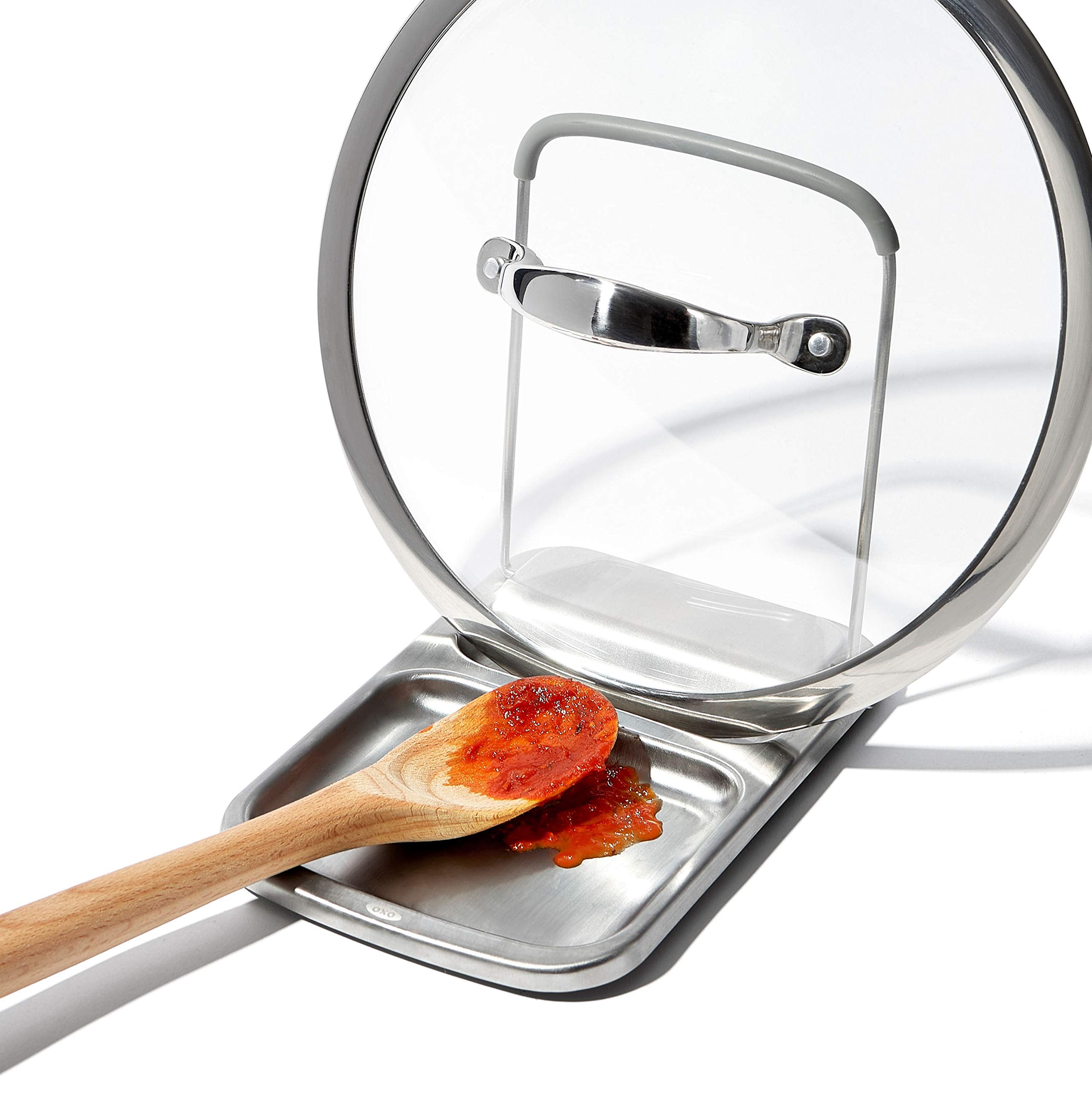 OXO Good Grips Spoon Rest sits on the stove edge protecting surrounding surfaces.