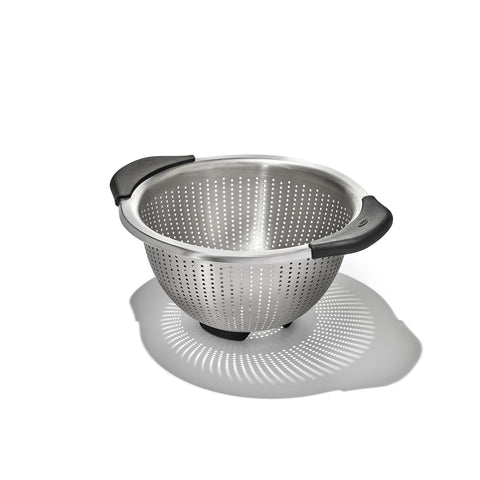 OXO Good Grips colander close-up highlighting elevated handles for secure rinsing