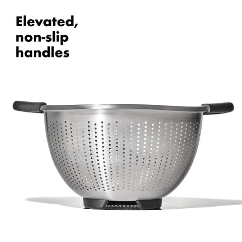 OXO Good Grips colander in use with steady handles and smooth pouring