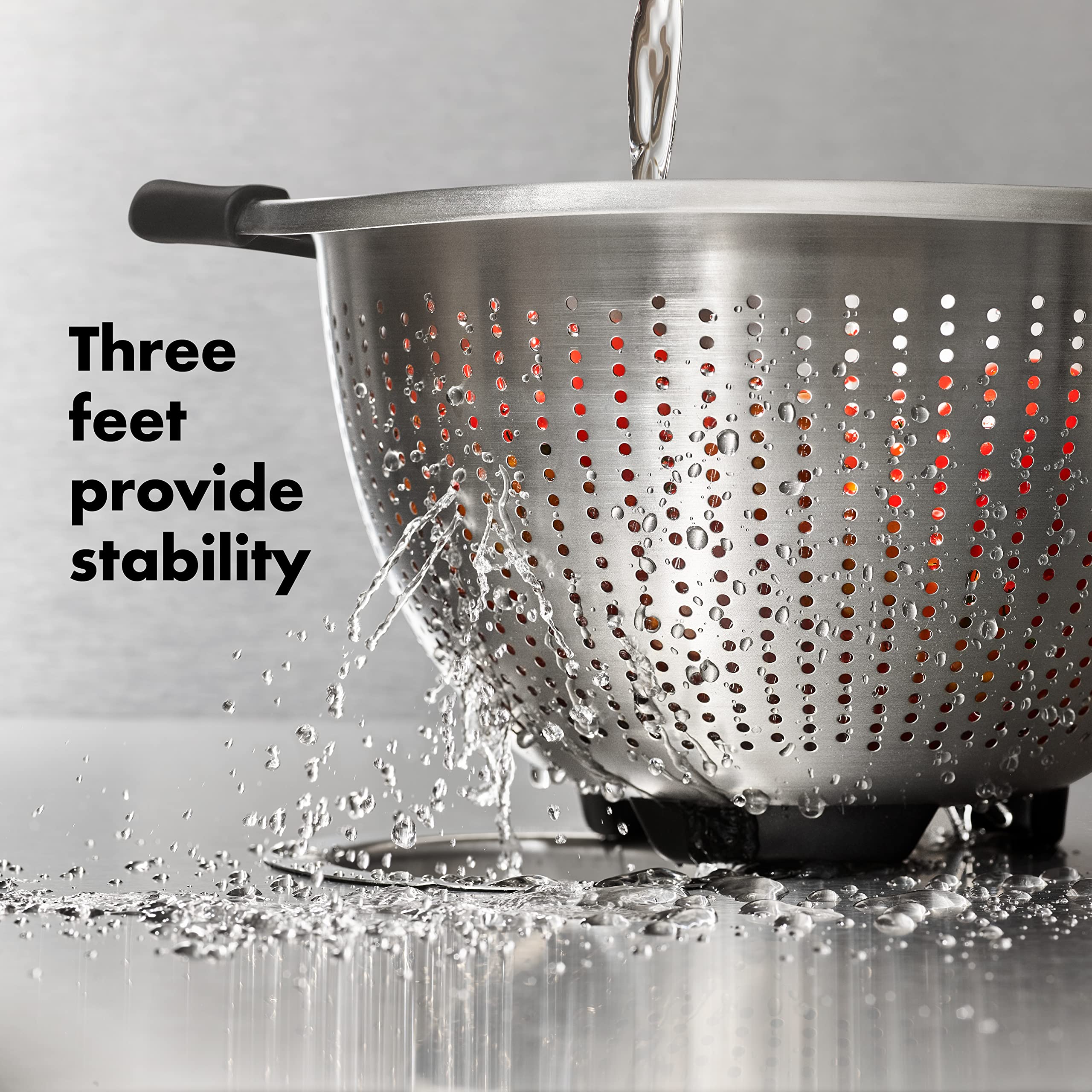 OXO Good Grips colander with three feet resting securely in sink