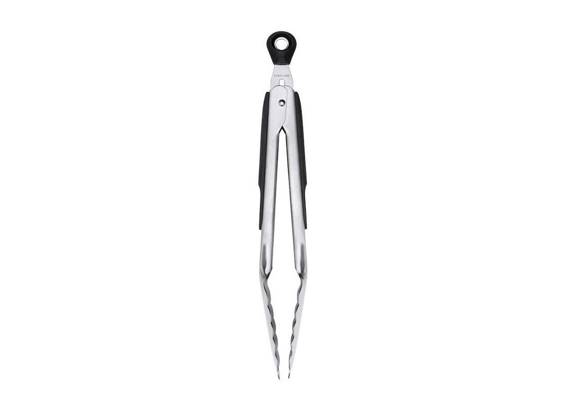 OXO Good Grips tongs with scalloped edges securely gripping foods