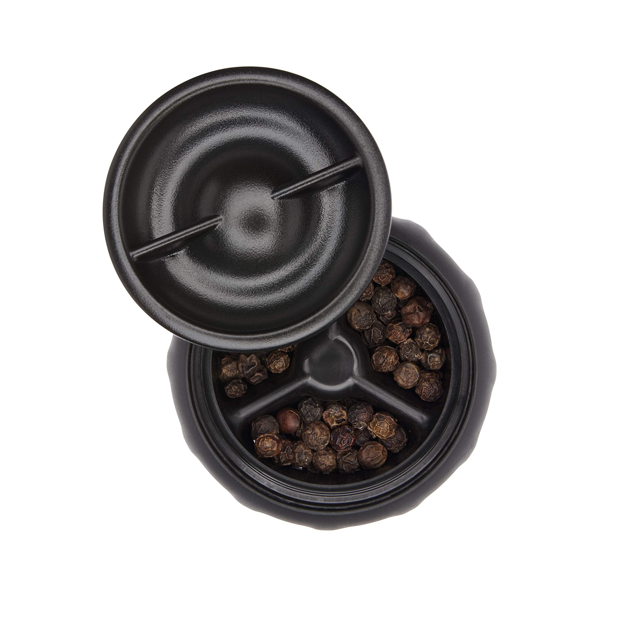 OXO grinders on a dining setup emphasize elegant, practical seasoning.