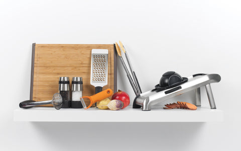 OXO salt and pepper grinders refilling cap removal with simple twist.