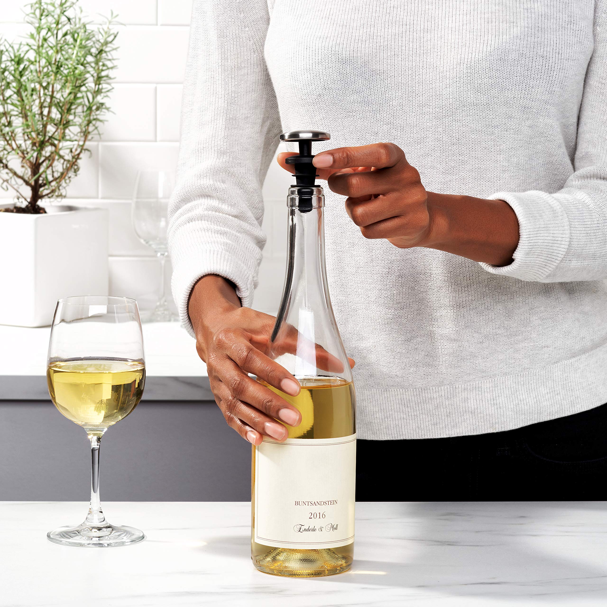 OXO SteeL stopper shown for lying-down storage with leak-proof seal.