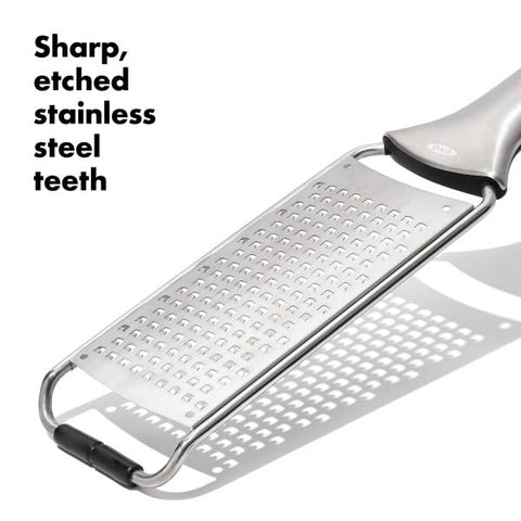OXO Steel Grater producing cheese shavings ideal for pasta toppings.
