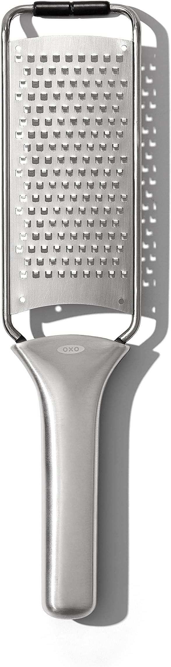 OXO Steel Grater creating chocolate curls to finish a cake.