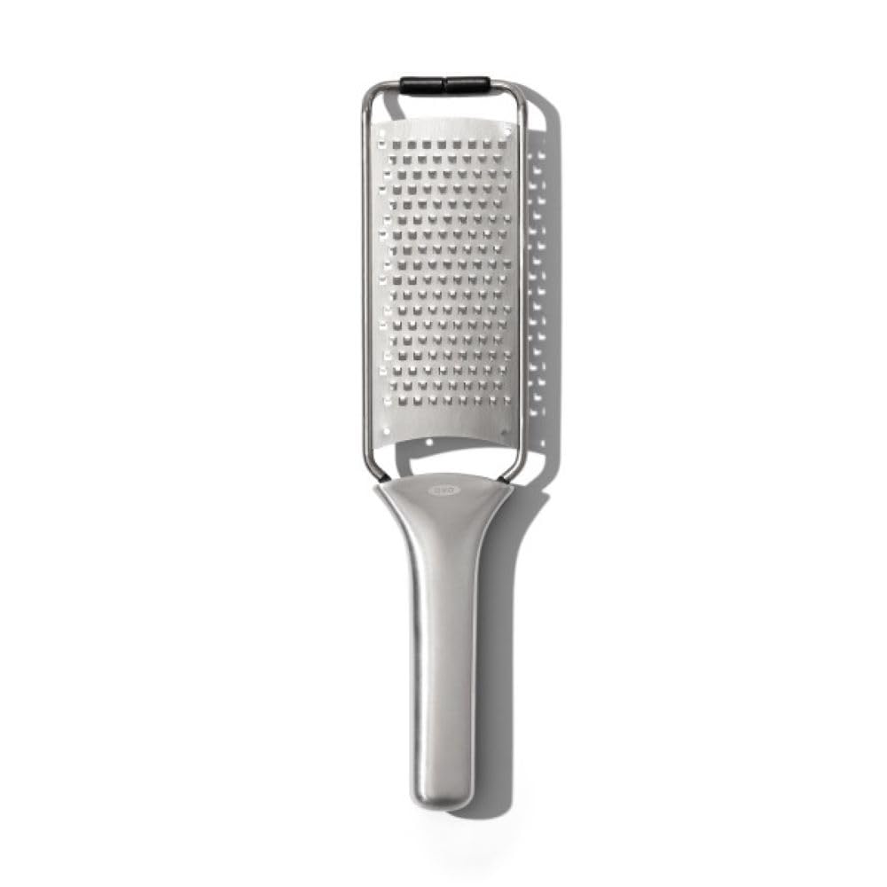 OXO Steel Grater with etched teeth for effortless cheese and vegetables.