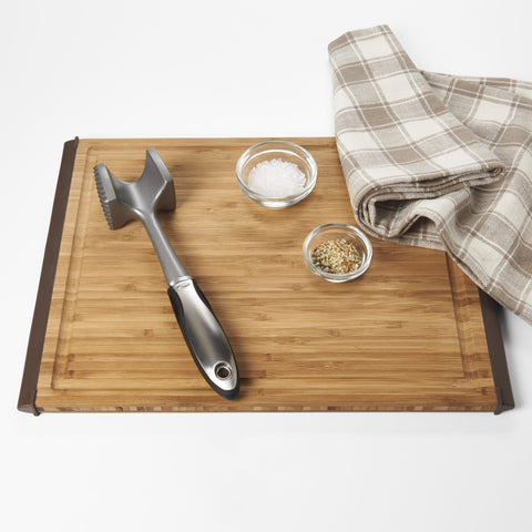OXO SteeL meat tenderizer ideal for pounding and tenderizing meat efficiently.
