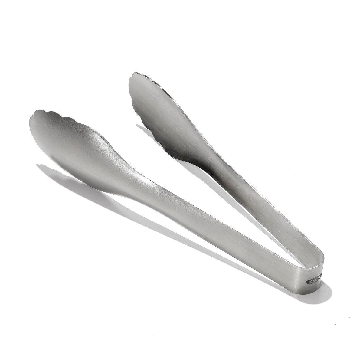OXO Steel Serving Tongs with scalloped heads offer secure grip for salads and pasta servings.