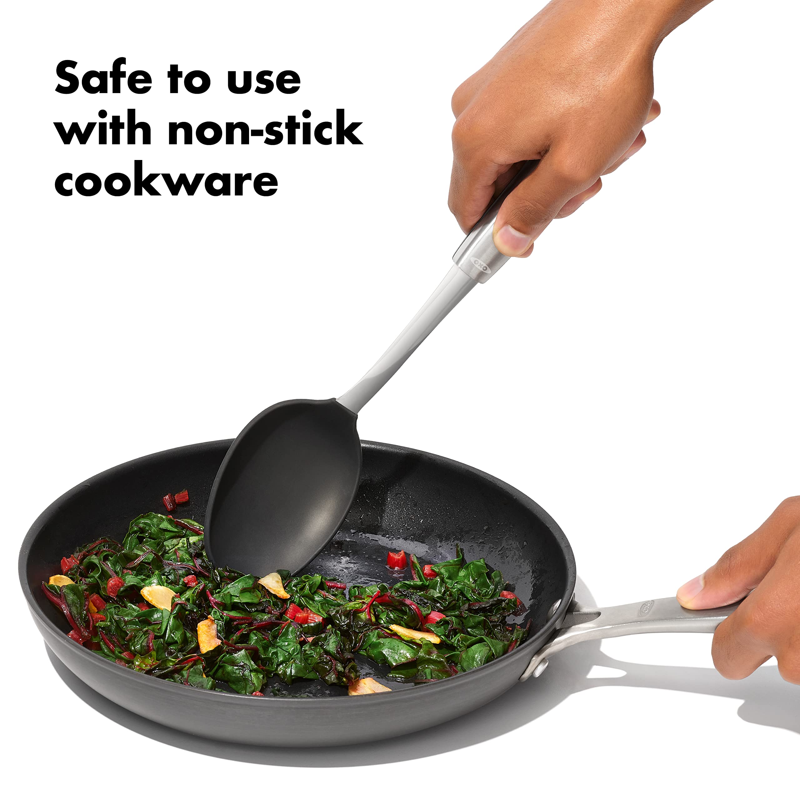 OXO steel silicone spoon used for stirring soups in non-stick pots