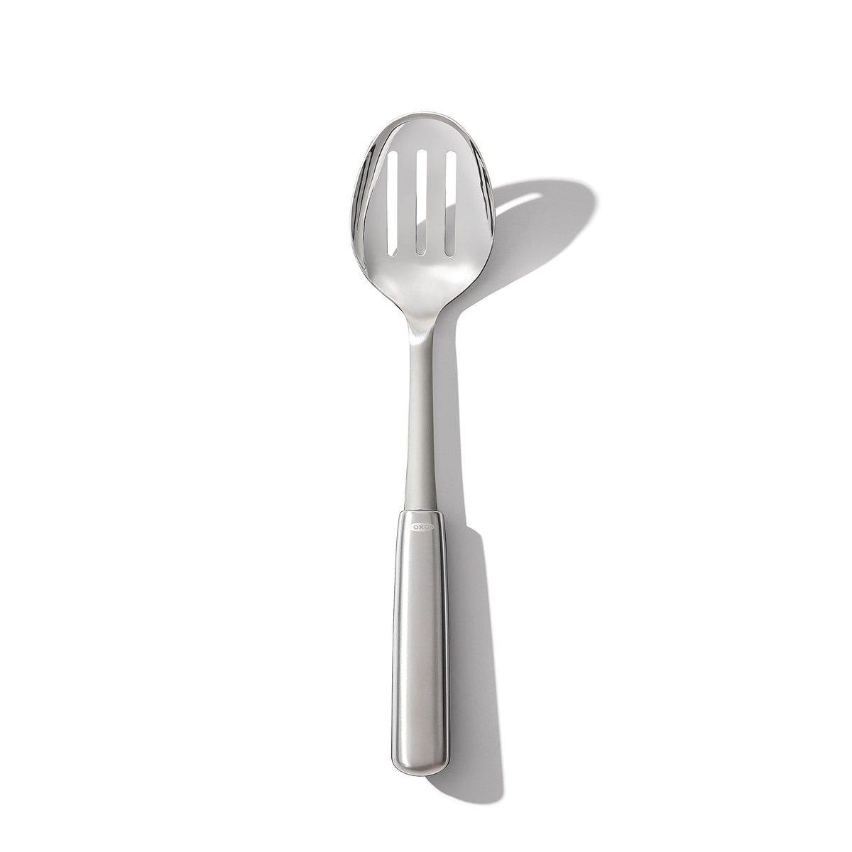 OXO Steel Slotted Cooking Spoon close-up shows durable stainless steel for everyday use