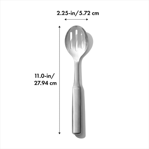 OXO Steel Slotted Serving Spoon lifting vegetables from a pot