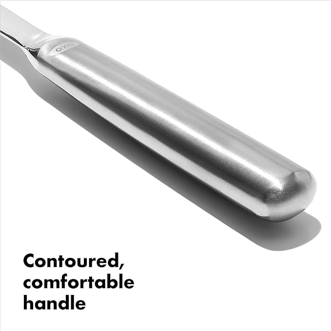 OXO Steel Slotted Serving Spoon ready to serve at the table