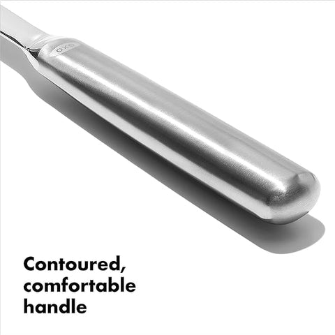 OXO Steel Slotted Serving Spoon ready to serve at the table