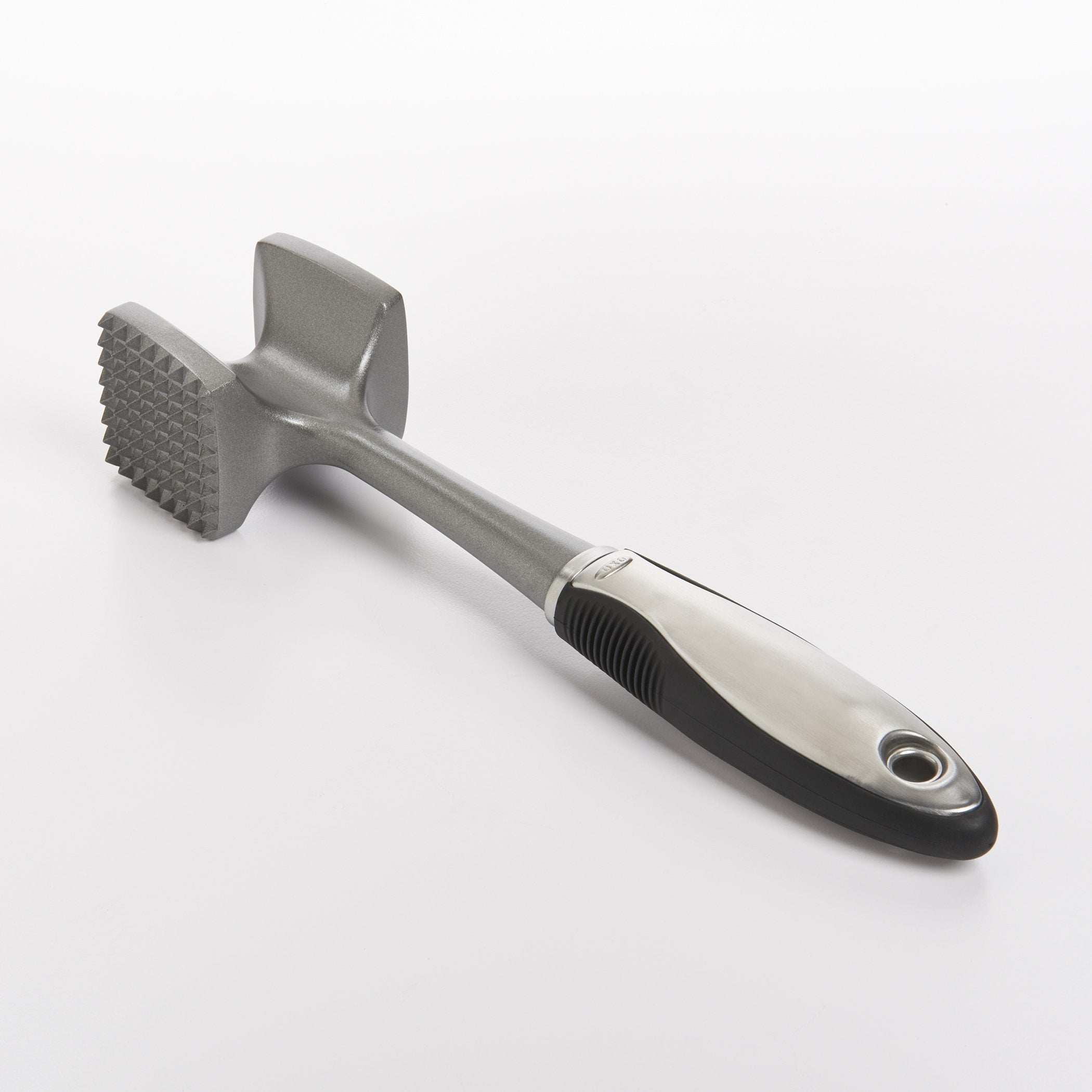 OXO SteeL soft grip tenderizer with comfortable handling during pounding.