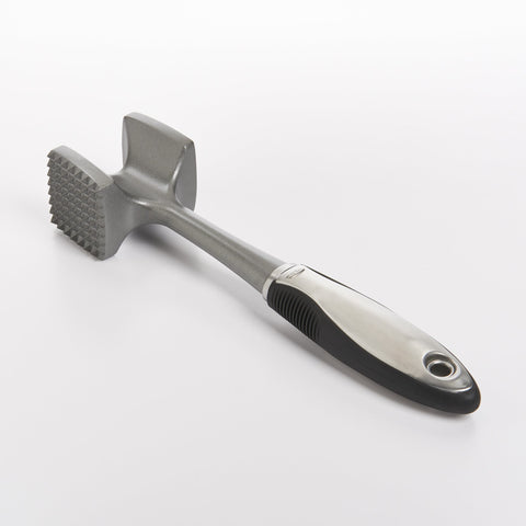 OXO SteeL soft grip tenderizer with comfortable handling during pounding.