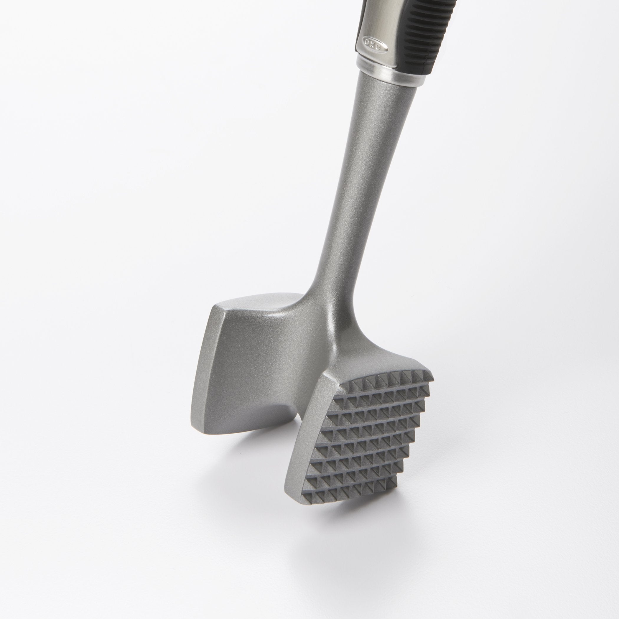 OXO SteeL tenderizer shows solid aluminum construction for durable pounding.