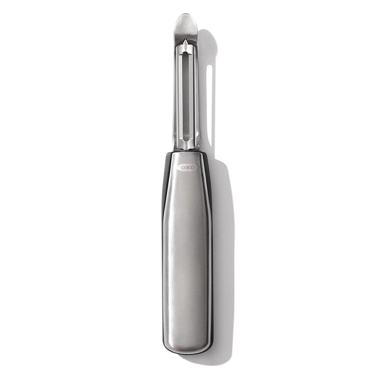 OXO Steel Swivel Peeler blade close-up shows a sharp edge for effortless peeling.