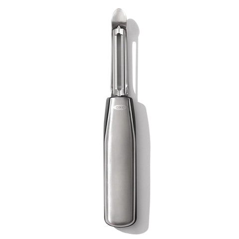 OXO Steel Swivel Peeler blade close-up shows a sharp edge for effortless peeling.