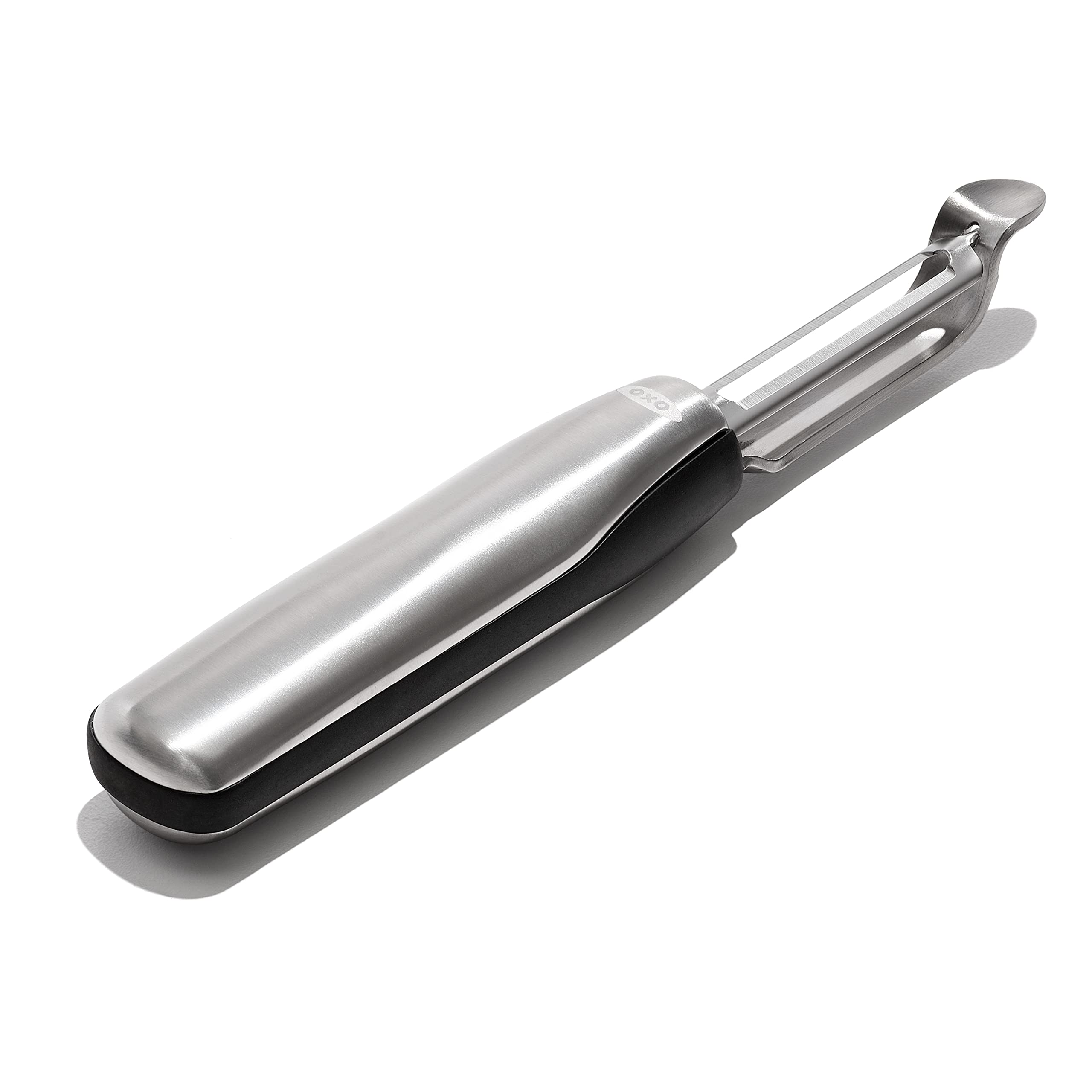 OXO Steel Swivel Peeler handle close-up highlighting ergonomic grip for precise control.