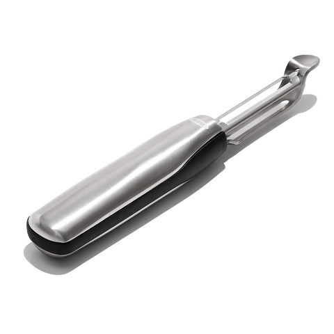 OXO Steel Swivel Peeler handle close-up highlighting ergonomic grip for precise control.