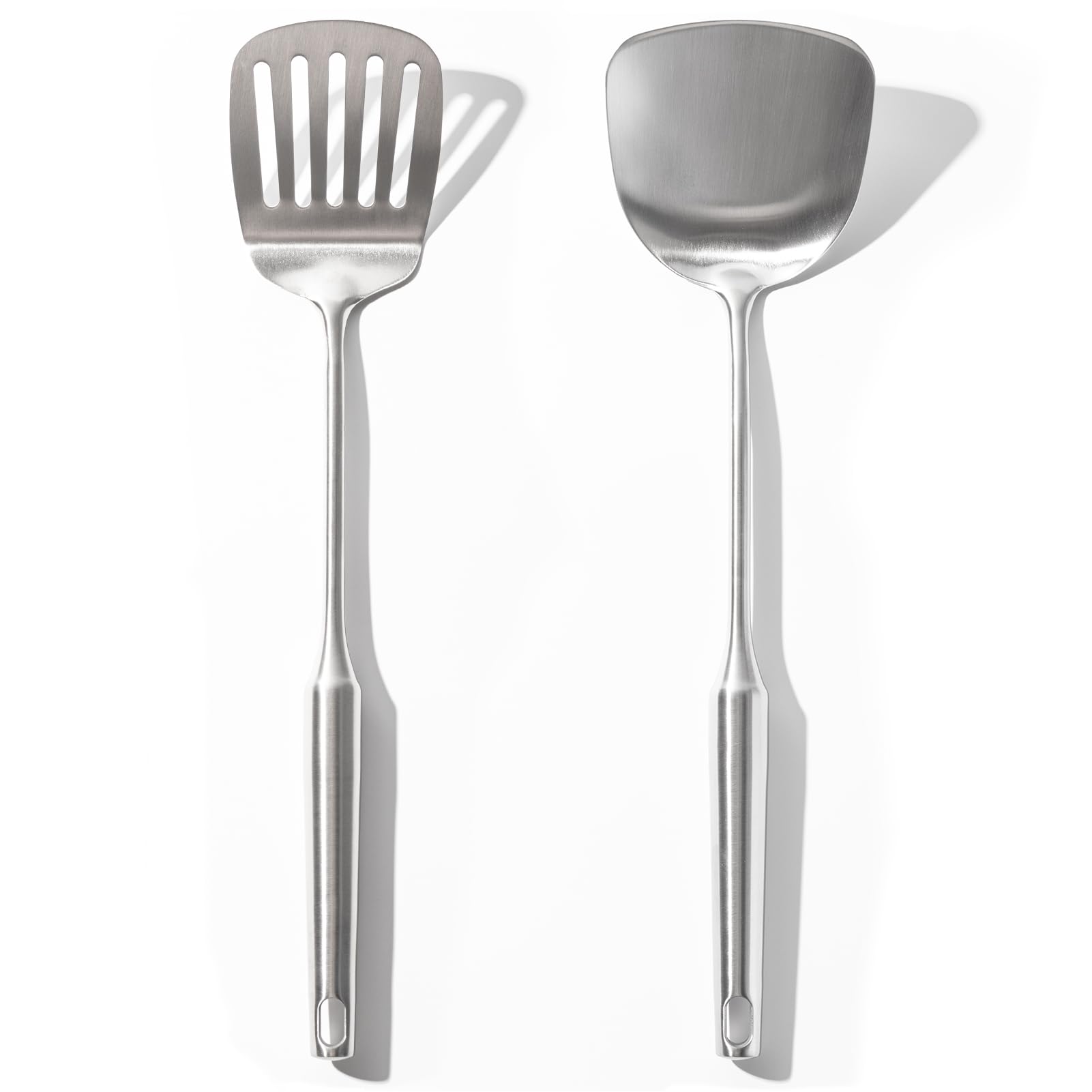 OYV 18/10 stainless steel slotted spatula for precise flipping of meats and vegetables.