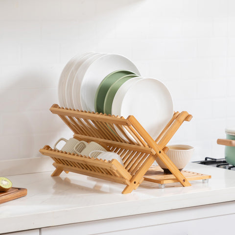Oyydecor bamboo dish drying rack on a kitchen counter for easy access.