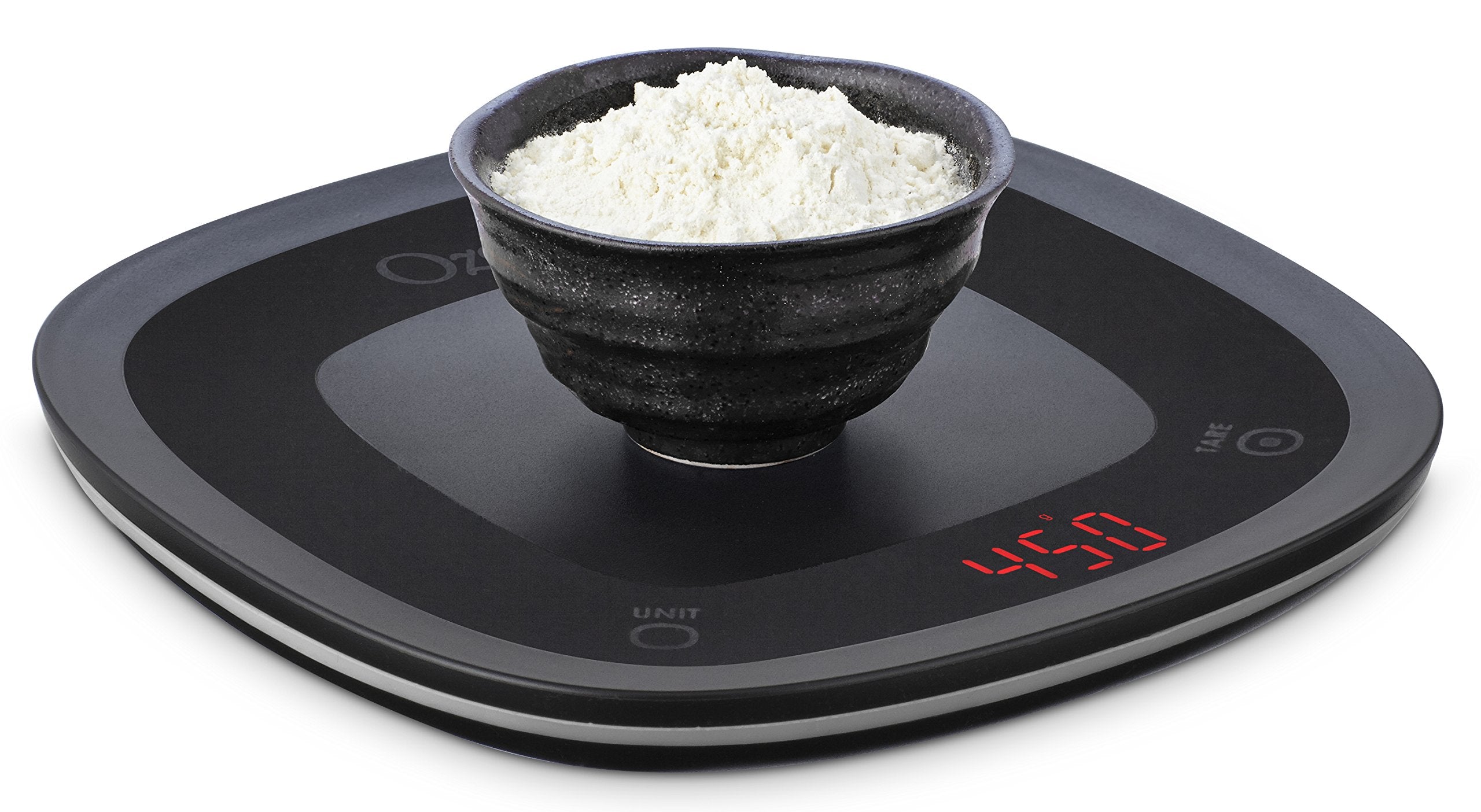 Ozeri Touch waterproof test under running water demonstrates easy cleaning.
