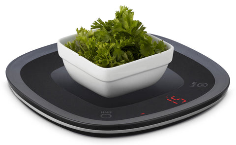 Ozeri Touch weighs ingredients with container using tare to subtract weight.