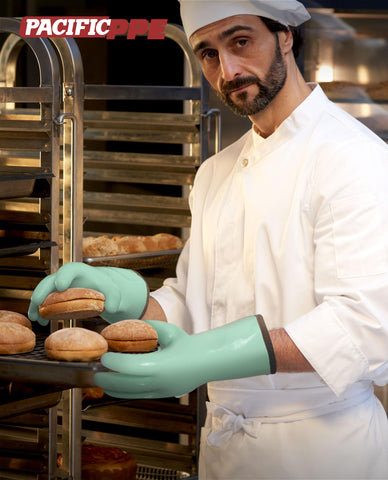 PACIFIC PPE oven gloves in action during grilling with extended cuff protection.