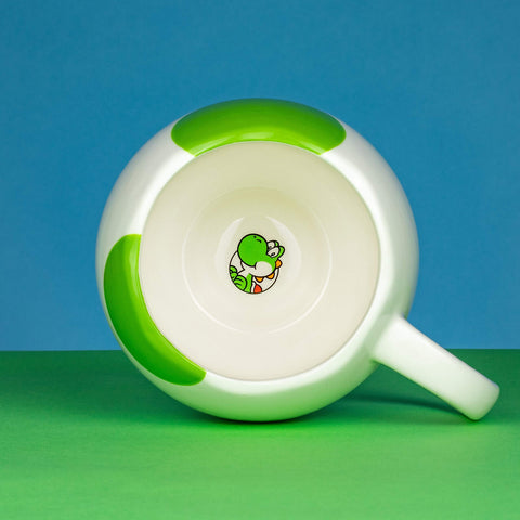 Paladone Yoshi egg mug on a desk, a fun collectible for fans