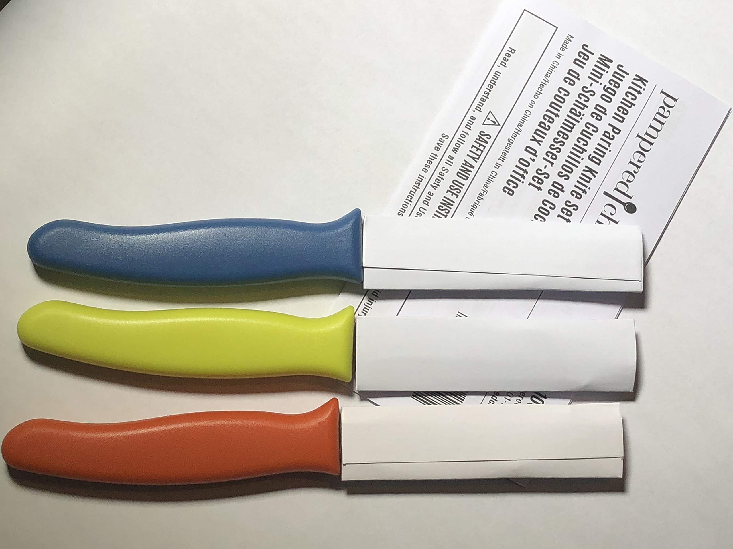 Pampered Chef 3-piece paring knife set in kitchen demonstrates compact efficiency for everyday tasks.