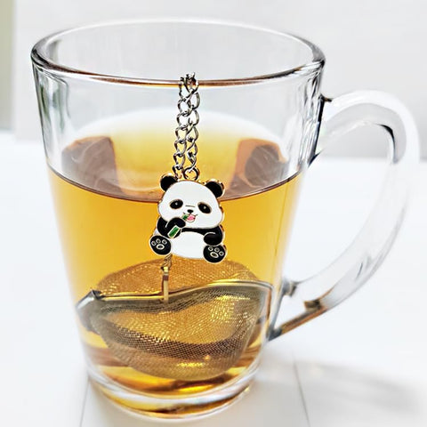 Panda stainless steel tea ball with heart design for precise filtration.
